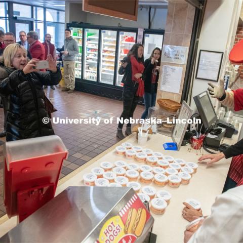 Donde Plowman takes a picture of the East Campus Administration who were serving up ice cream for the Charter Day open house at the Dairy Store on East Campus. A special N150 ice cream flavor Nifty 150 was served as part of N150's Charter Week celebration. February 15, 2019. Photo by Gregory Nathan / University Communication.